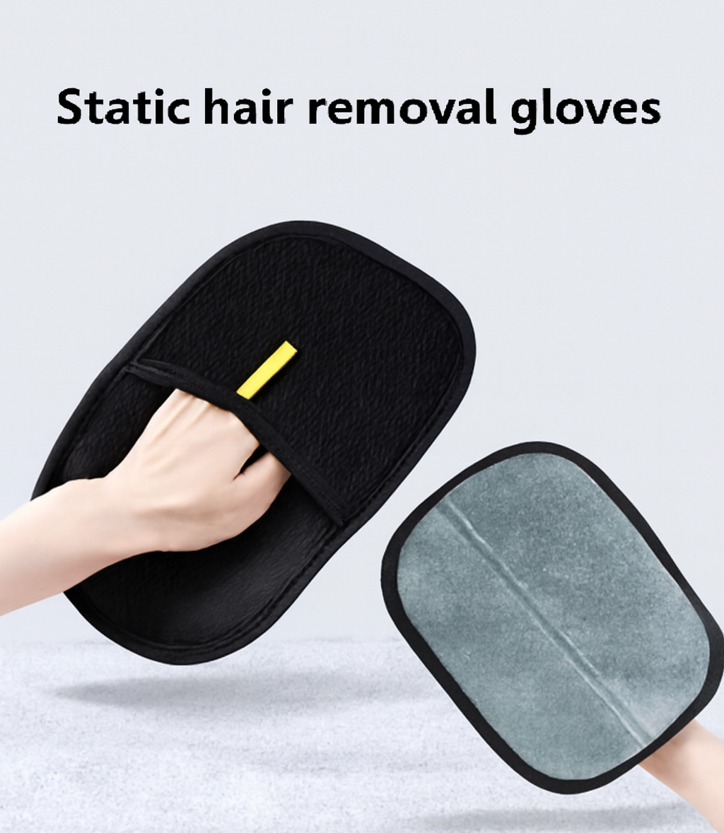 Black static hair removal gloves with a gray pad, held by a hand on a light gray background.