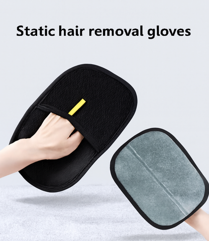 Black static hair removal gloves with a gray pad, held by a hand on a light gray background.